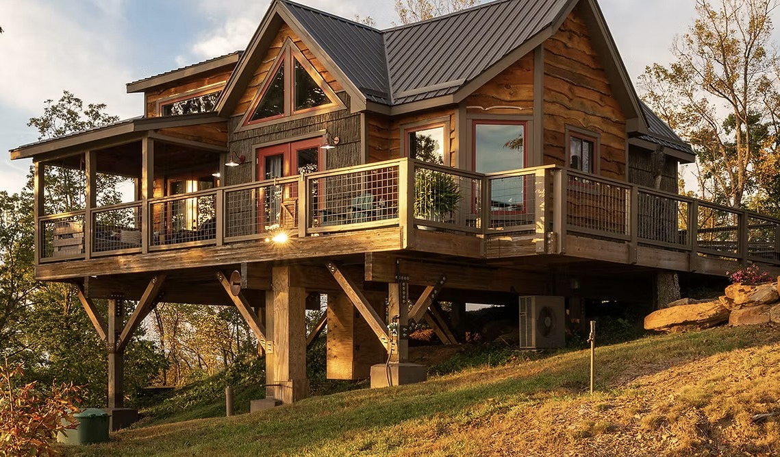 The full exterior of The Perch above the hillside